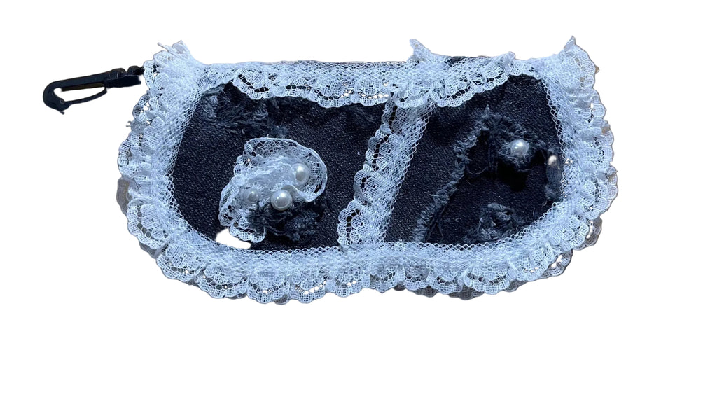 Black lace lingerie set on a wooden surface